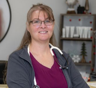 Jody-Homepage-Image.webp Jody Buchanan, WHNP-BC smiling